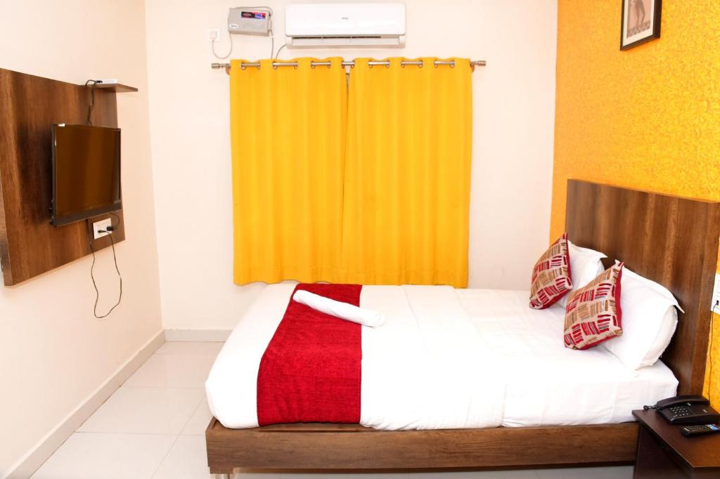 Letto o letti in una camera di Harsha Comforts