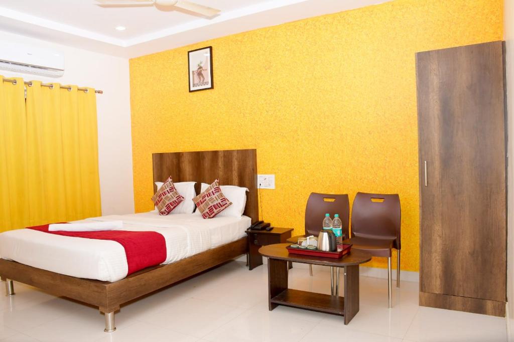 Letto o letti in una camera di Harsha Comforts