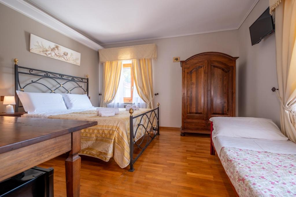 Postel nebo postele na pokoji v ubytování Agriturismo Beata Vanna