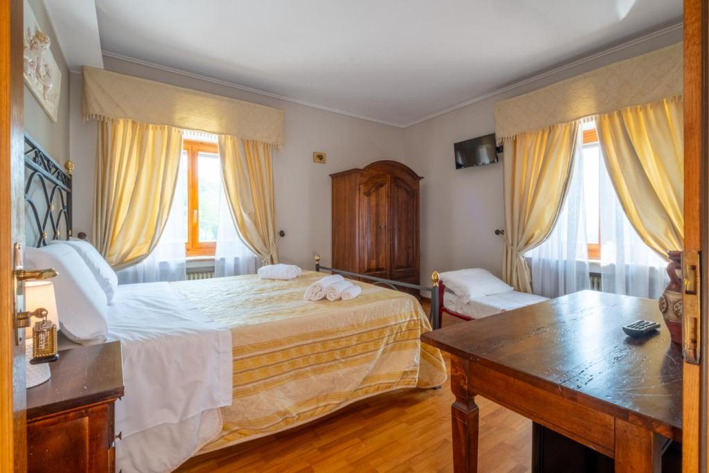 Postel nebo postele na pokoji v ubytování Agriturismo Beata Vanna