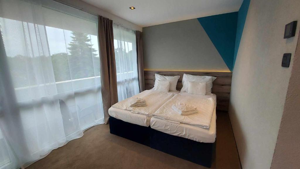 Postel nebo postele na pokoji v ubytování Hotel Szieszta