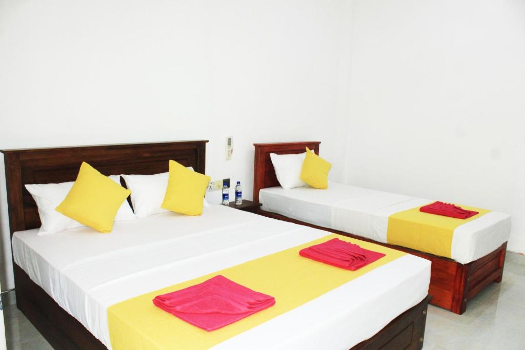 Ένα ή περισσότερα κρεβάτια σε δωμάτιο στο Sigiri Garden Villa