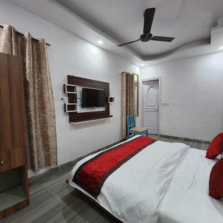 Postel nebo postele na pokoji v ubytování HOTEL ROYAL AFGHAN