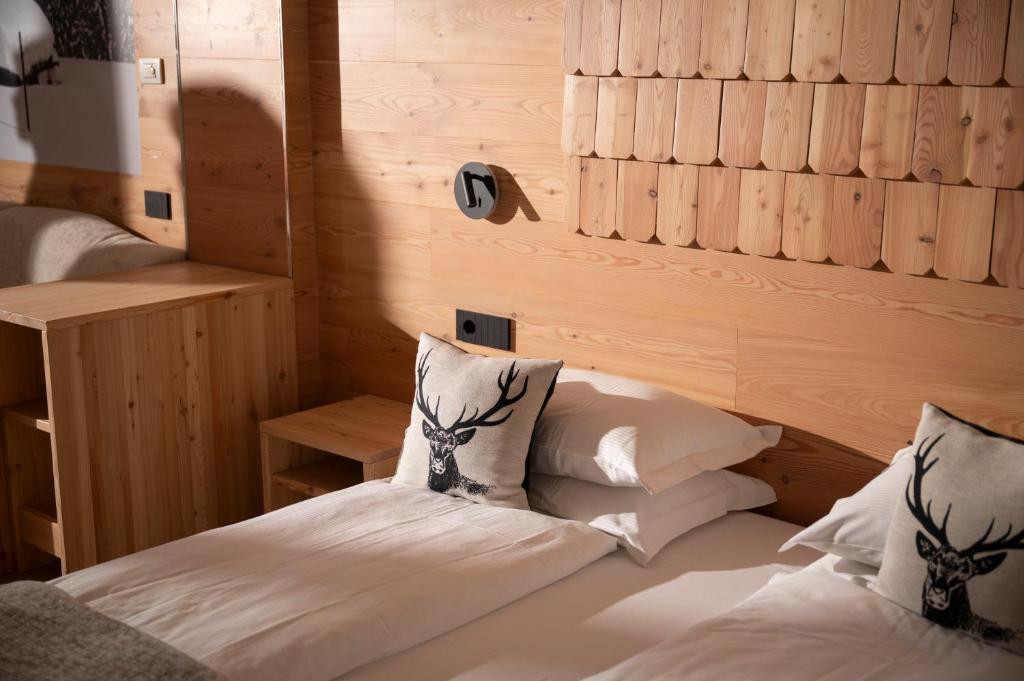 Postel nebo postele na pokoji v ubytování Hotel Dahu