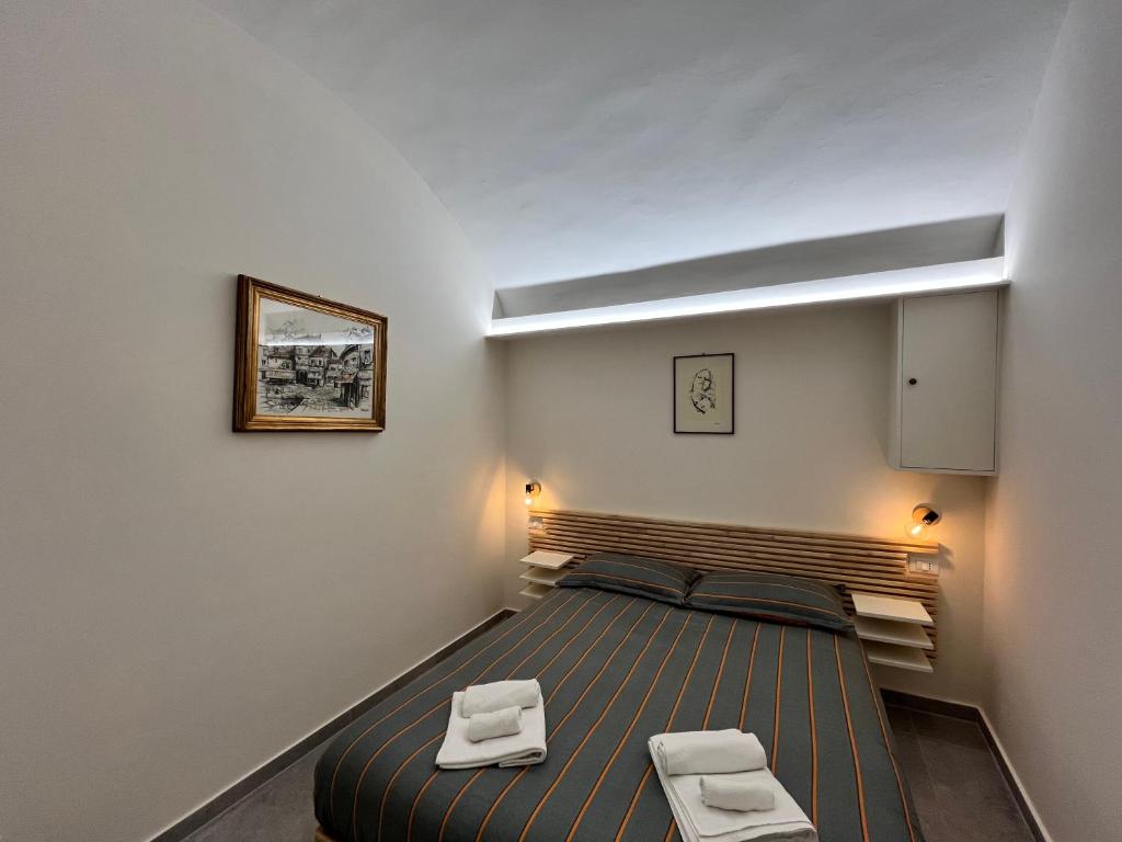 Postel nebo postele na pokoji v ubytování Suite San Domenico - Host by Traveller's Nest