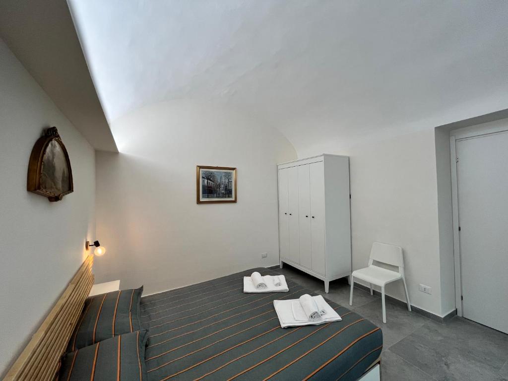 Postel nebo postele na pokoji v ubytování Suite San Domenico - Host by Traveller's Nest