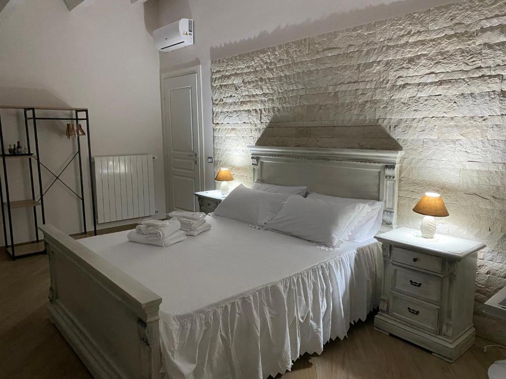 Postel nebo postele na pokoji v ubytování Villa Giusy