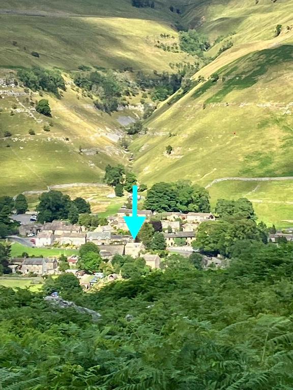 an aerial view of a village in the hills at The Dale - Luxurious annexe with stunning view in Buckden