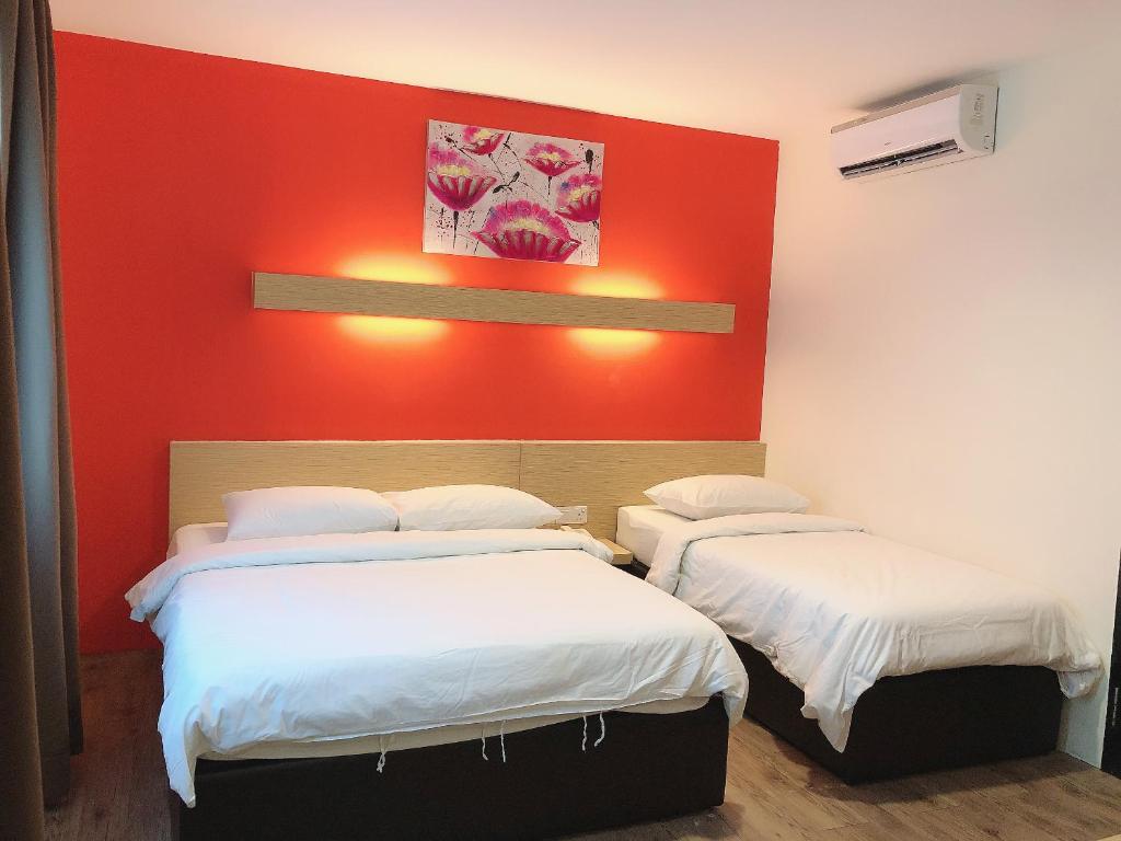 Postel nebo postele na pokoji v ubytování Tras Mutiara Hotel Bentong