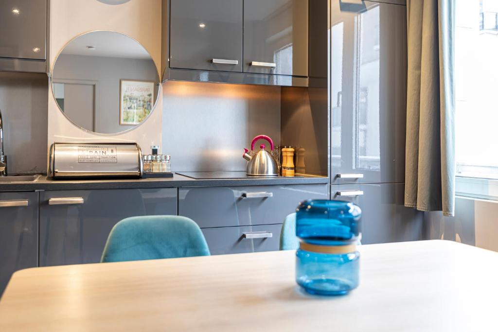 Kuchyňa alebo kuchynka v ubytovaní Les Appartements Cardinet