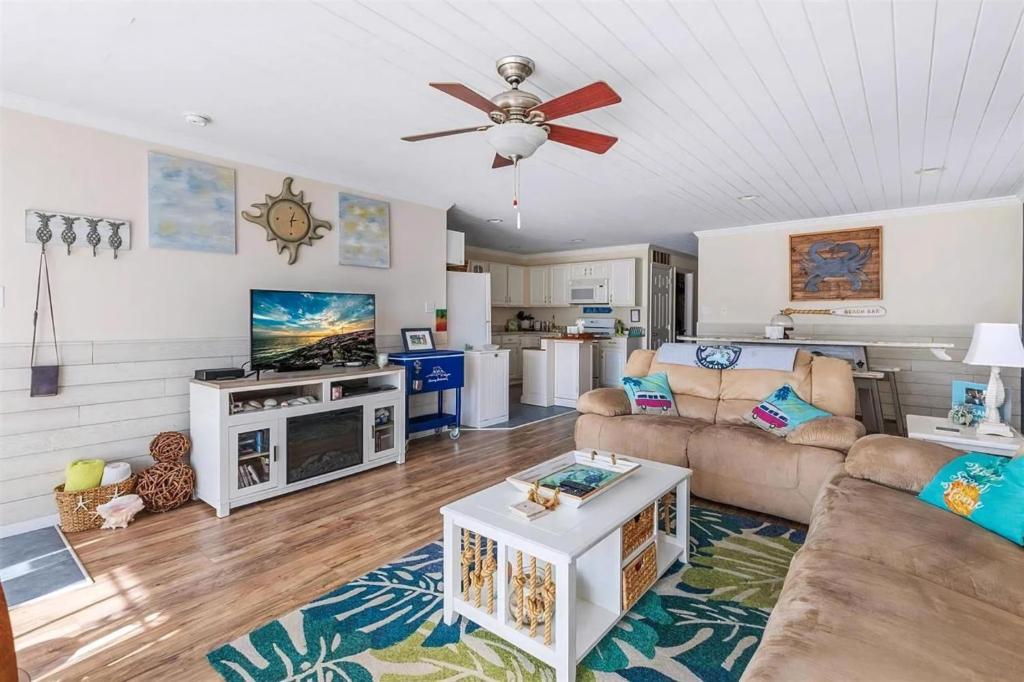 a living room with a couch and a table at Gorgeous 3 Bedroom Condo with Ocean Views & Garage Parking in Wildwood