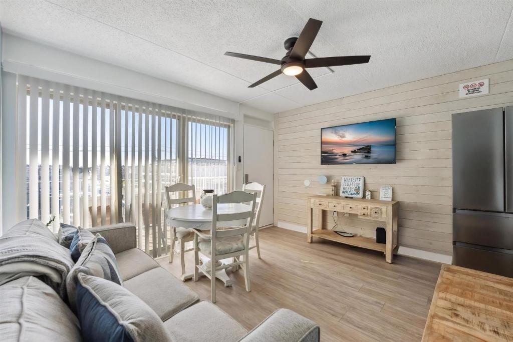 a living room with a couch and a ceiling fan at 301 Ocean Ave, Unit 304 - The Harbor Light in North Wildwood