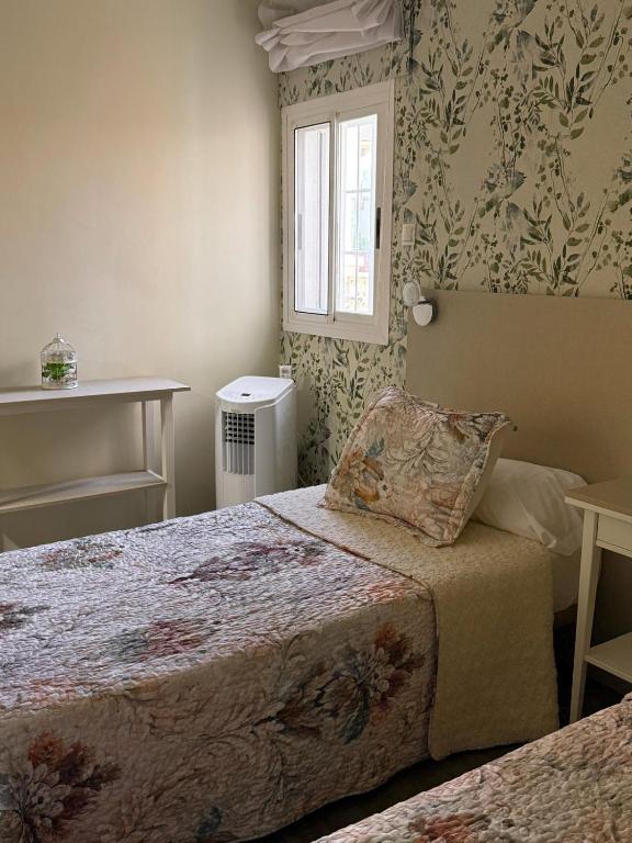 Postel nebo postele na pokoji v ubytování La casita de lola