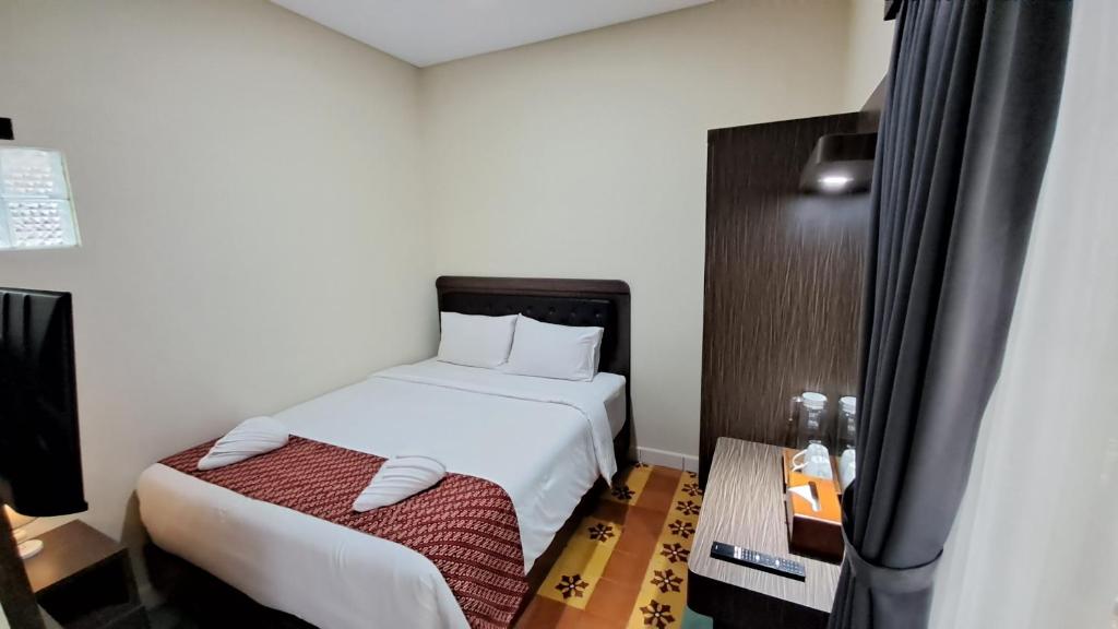 Yuwono Hotel & Villa Malioboro客房内的一张或多张床位