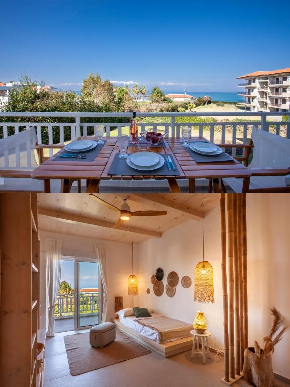 a room with a table and a view of the ocean at Calypso beach front apartment in Hanioti