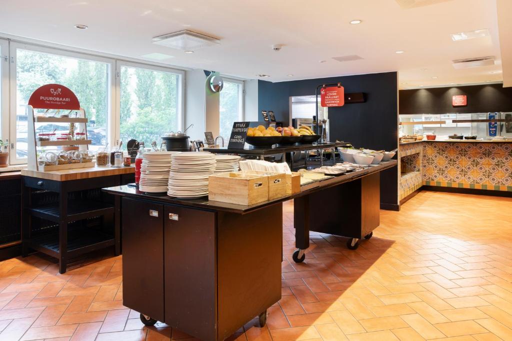 Kuchyň nebo kuchyňský kout v ubytování Original Sokos Hotel Albert