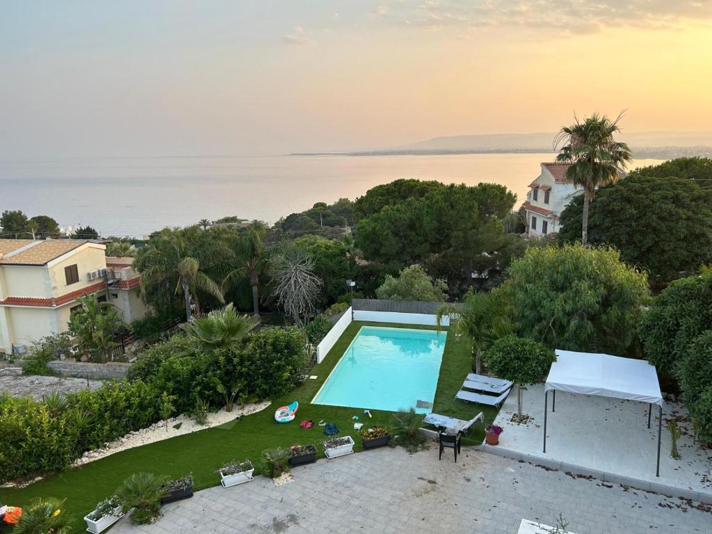 an aerial view of a house with a swimming pool at Villa al Plemmirio Luxury in Plemmirio