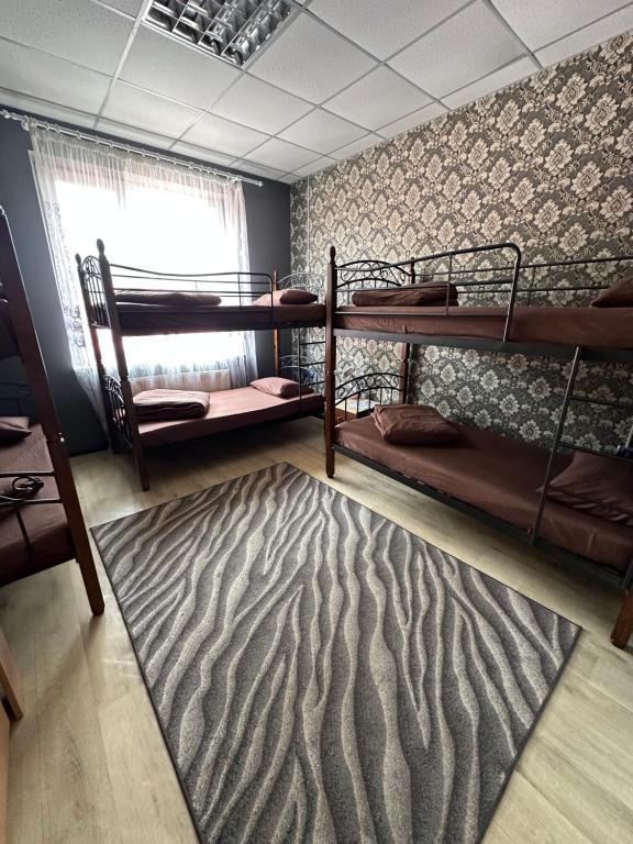 Postel nebo postele na pokoji v ubytování Welcome 24 Mukachevo