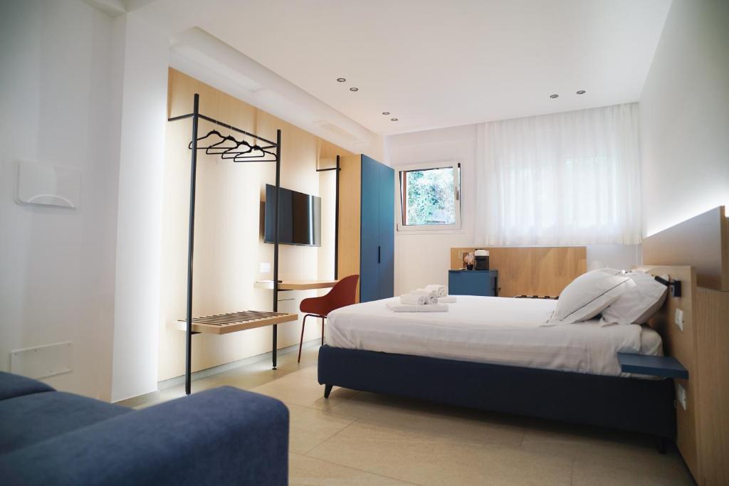 Giường trong phòng chung tại Regina Elena Luxury Apartments