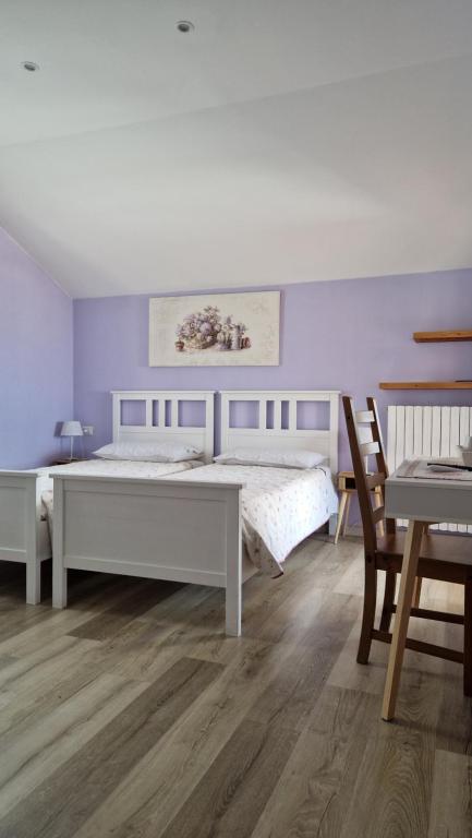 Postel nebo postele na pokoji v ubytování Foresteria Villa Simona