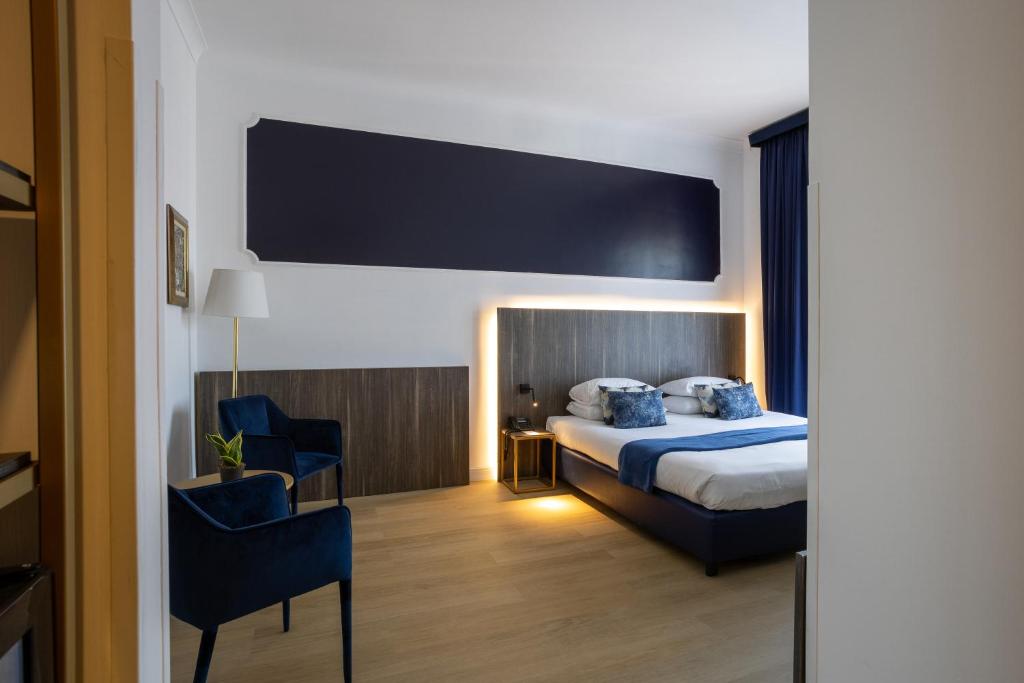 Postel nebo postele na pokoji v ubytování Grand Hotel Tiberio