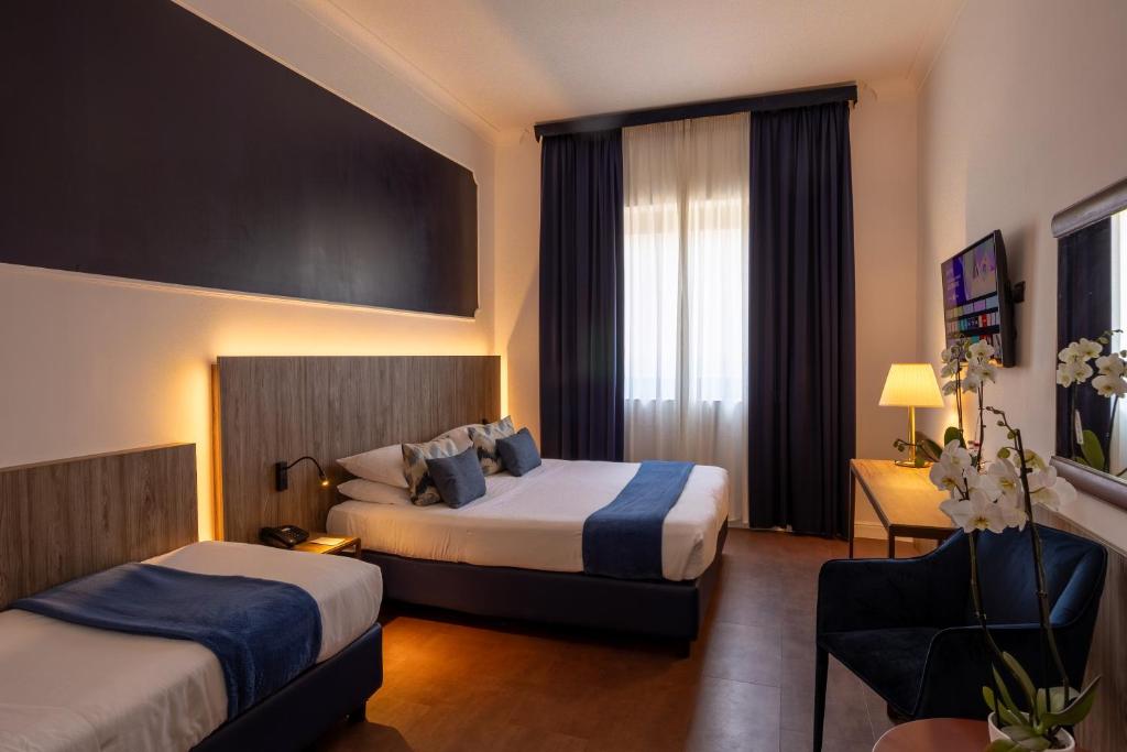 Postel nebo postele na pokoji v ubytování Grand Hotel Tiberio