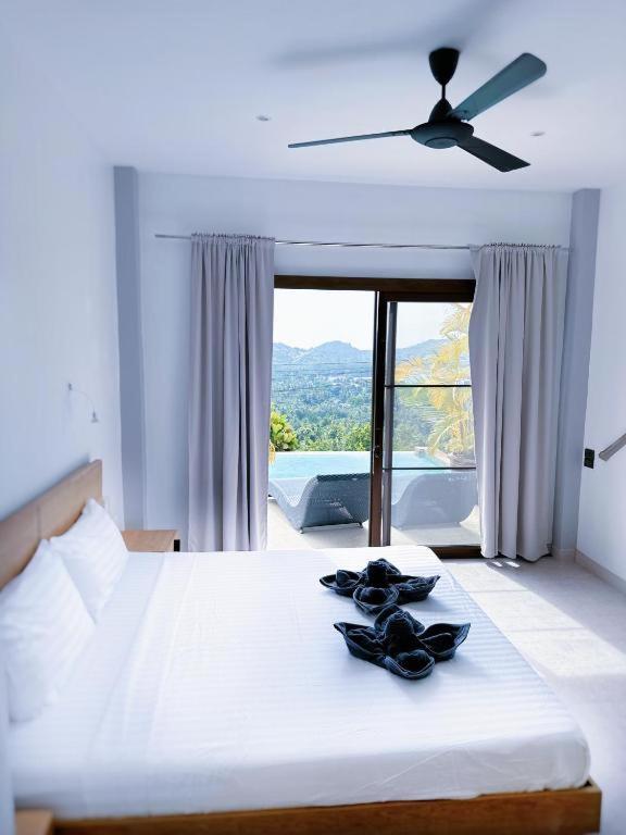 Postel nebo postele na pokoji v ubytování Mantra Sea View Villa
