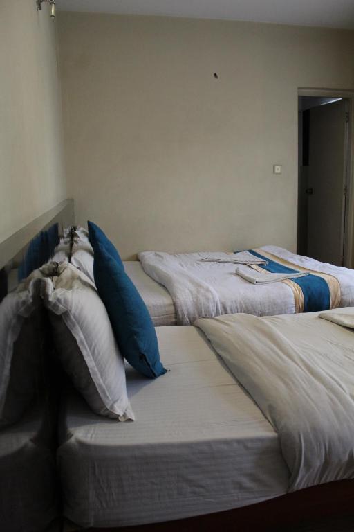Postel nebo postele na pokoji v ubytování 32 Peace Home