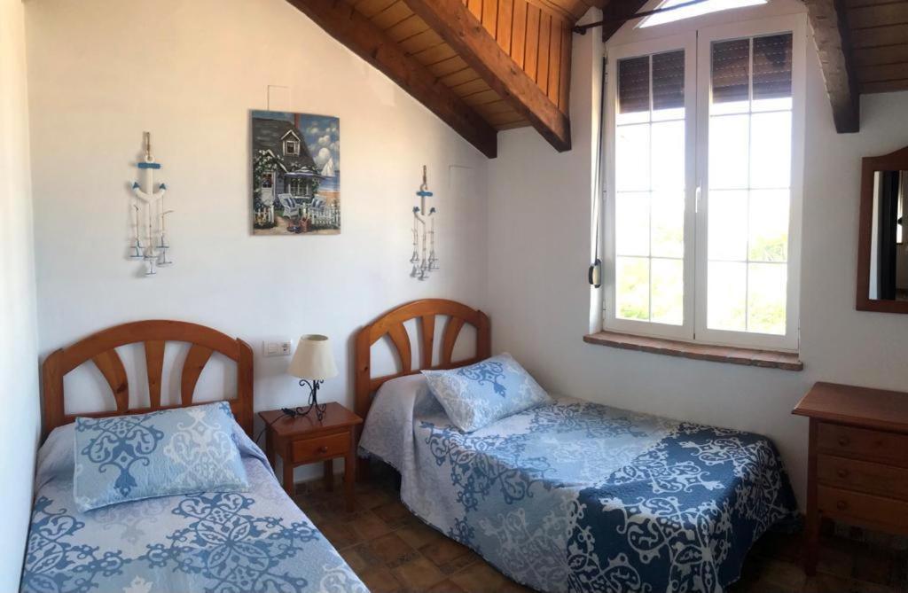 Postel nebo postele na pokoji v ubytování Conil, descanso en la dehesa