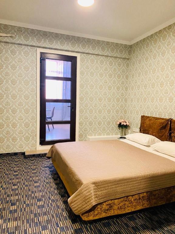 Postel nebo postele na pokoji v ubytování ArkPalmira