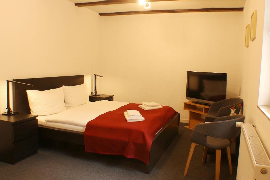 Postel nebo postele na pokoji v ubytování Sternhaus-Harz