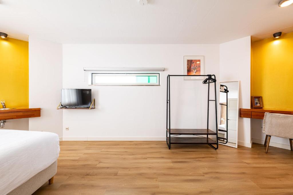 Postel nebo postele na pokoji v ubytování B&B De Tulpentoren