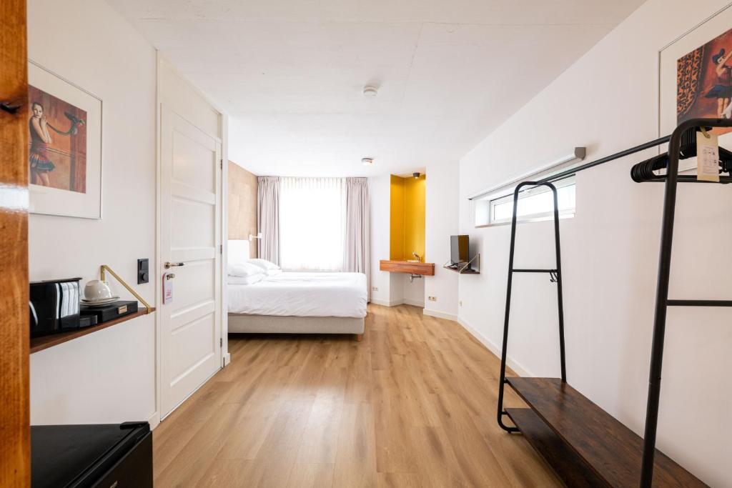 Postel nebo postele na pokoji v ubytování B&B De Tulpentoren