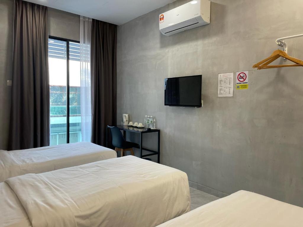 Postel nebo postele na pokoji v ubytování HPY Hotel