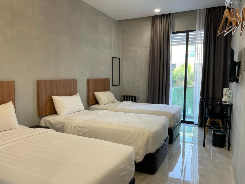 Postel nebo postele na pokoji v ubytování HPY Hotel
