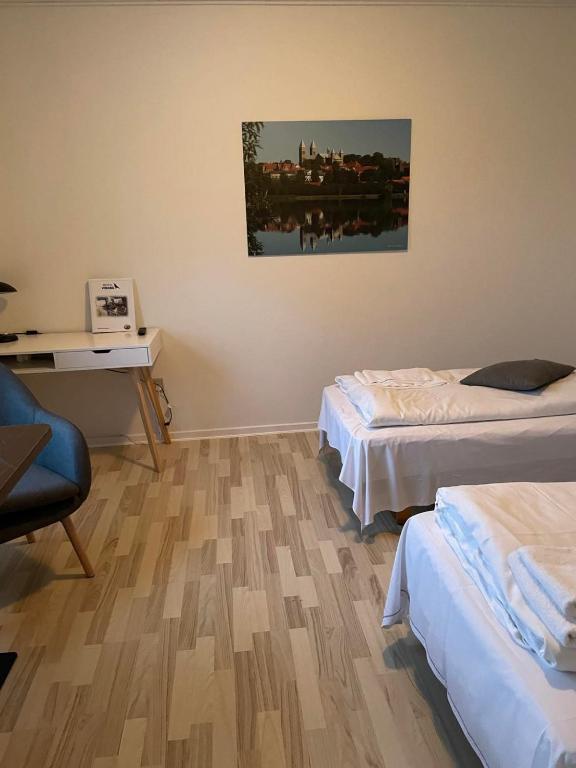Postel nebo postele na pokoji v ubytování Motel Viborg