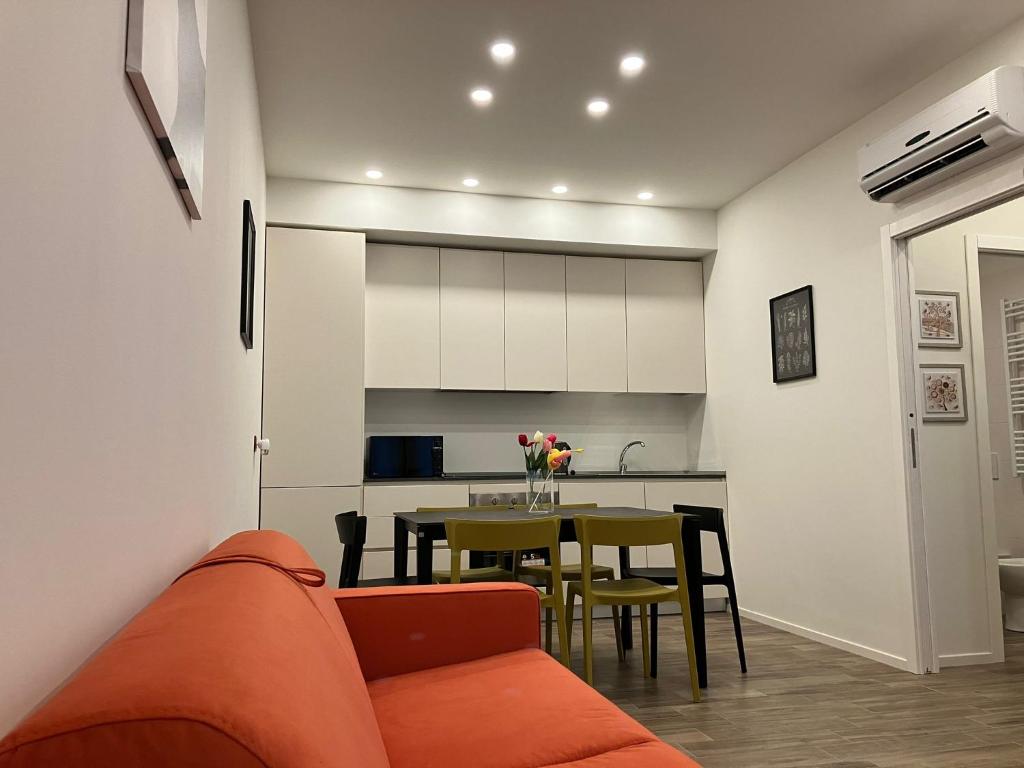 a living room with a couch and a table at Residenza Nannì in Senigallia