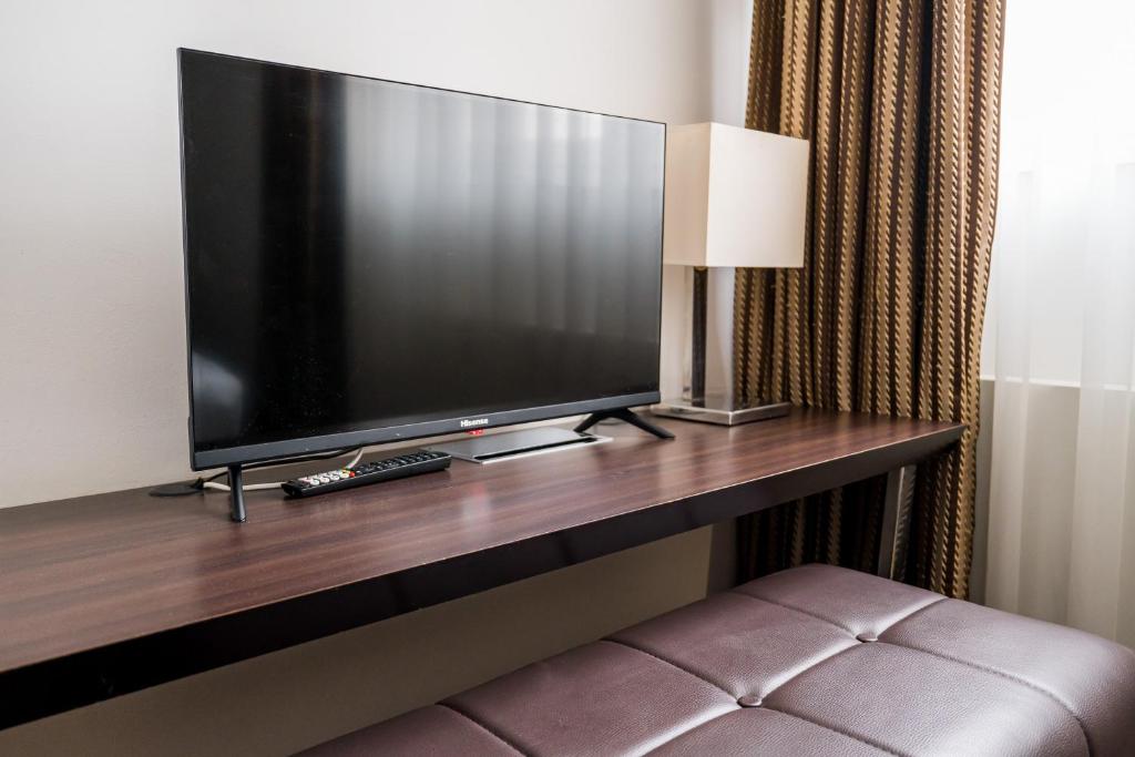 TV a/nebo společenská místnost v ubytování Homaris West Side