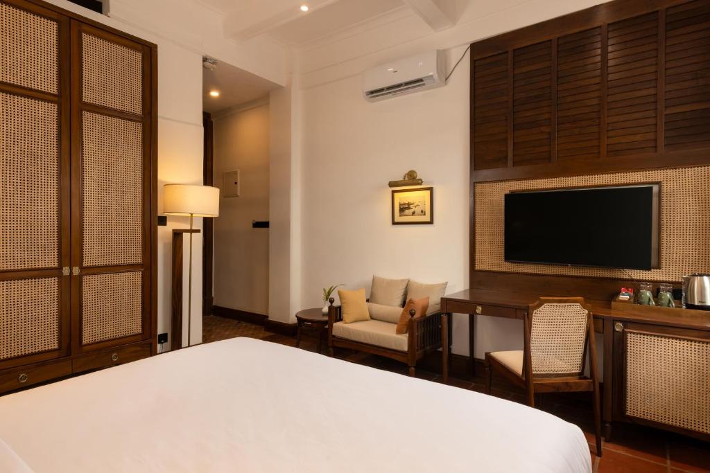 Postel nebo postele na pokoji v ubytování Hotel Suisse