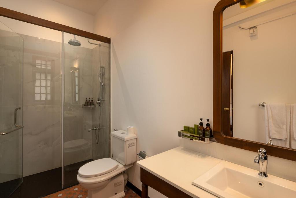 Koupelna v ubytování Hotel Suisse