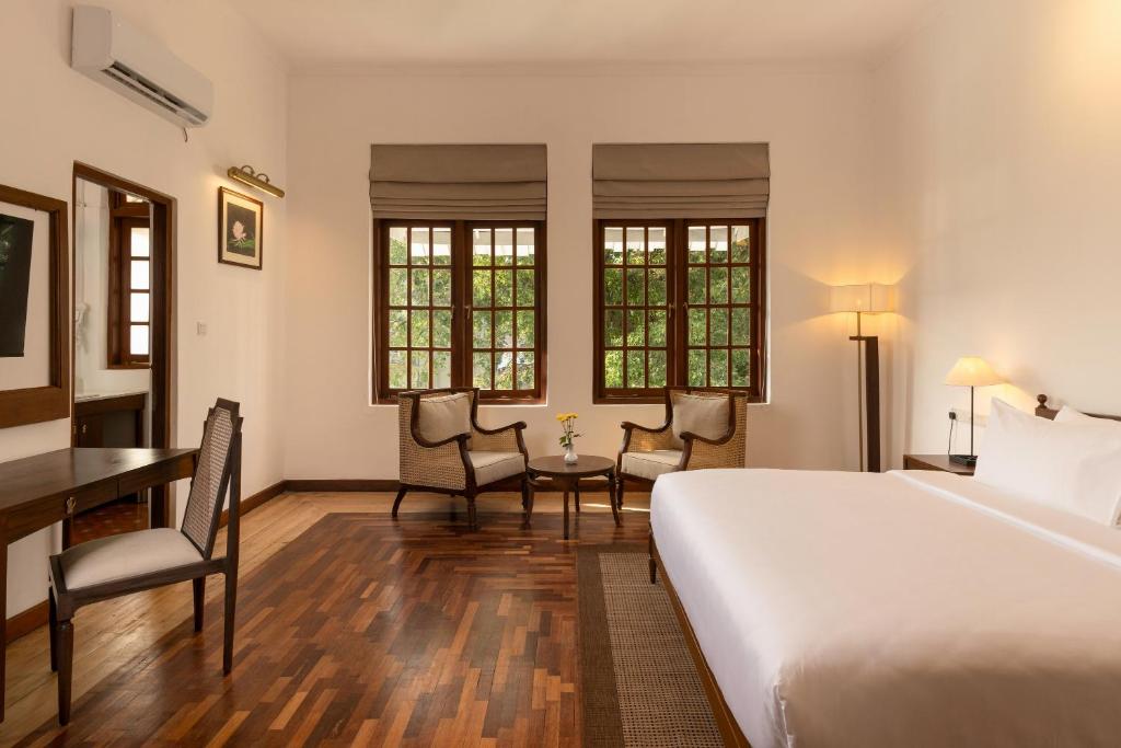 Postel nebo postele na pokoji v ubytování Hotel Suisse