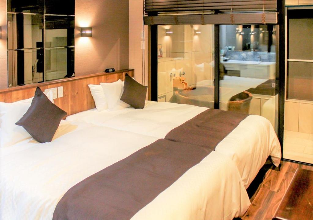 Postel nebo postele na pokoji v ubytování LiVEMAX RESORT Hakone Sengokuhara