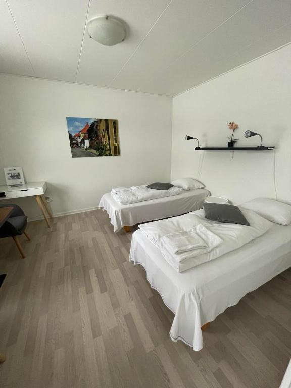Postel nebo postele na pokoji v ubytování Motel Viborg