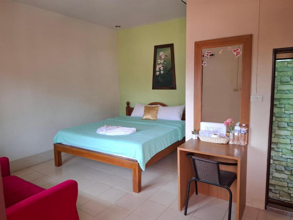 Postel nebo postele na pokoji v ubytování โรงแรมฟร้อนบีช frontbeach