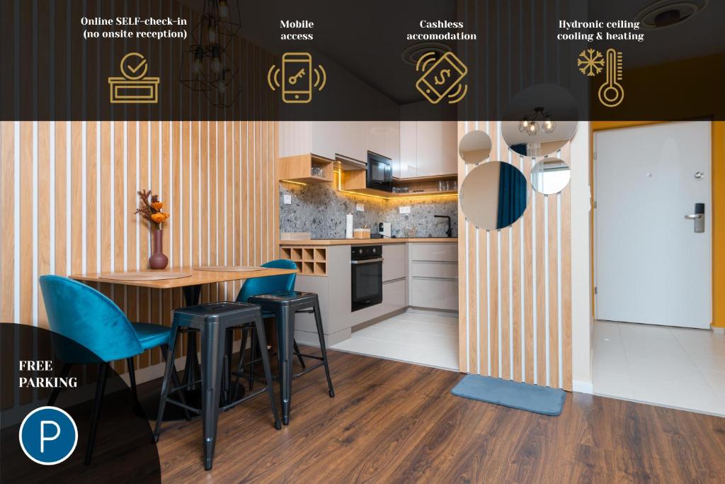 Hotel WaterFront City Apartments by FirstHost, a kitchen with blue chairs and a table in a room at WaterFront City Apartments by FirstHost in Budapest