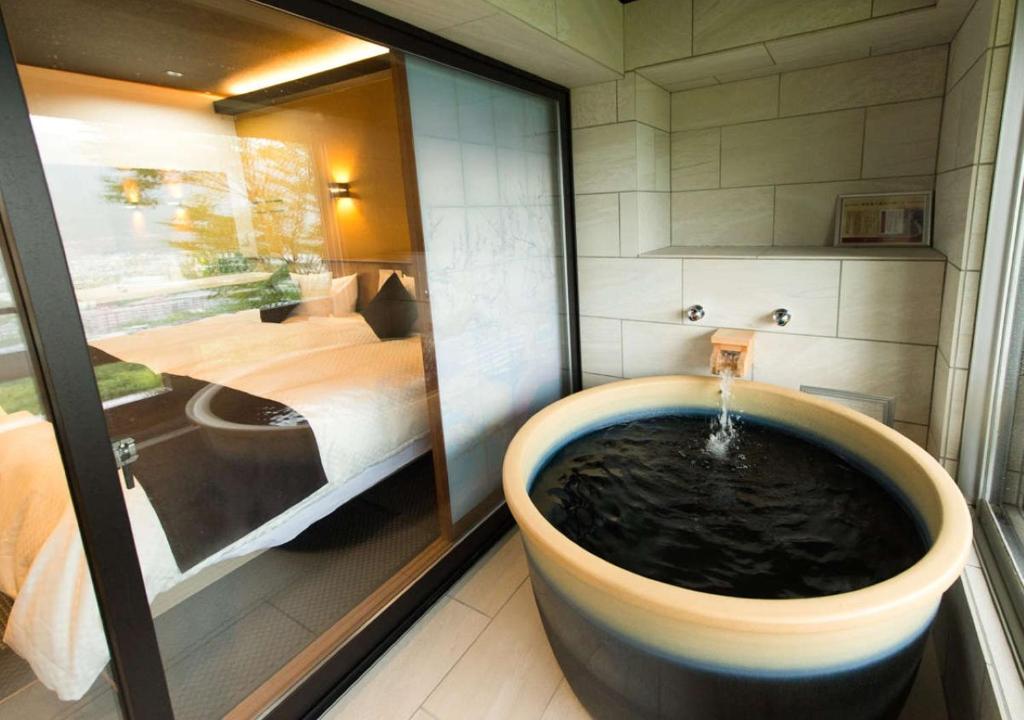 Postel nebo postele na pokoji v ubytování LiVEMAX RESORT Hakone Sengokuhara