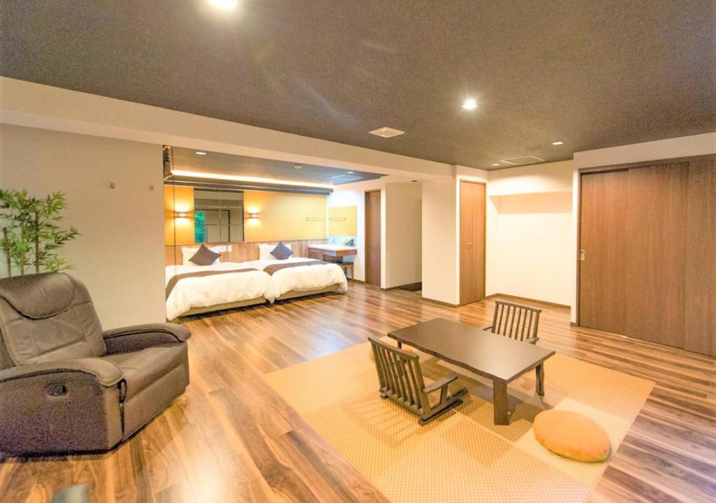Postel nebo postele na pokoji v ubytování LiVEMAX RESORT Hakone Sengokuhara