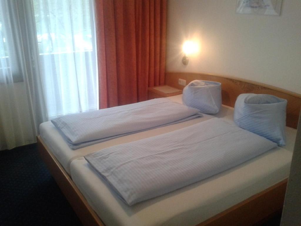 Postel nebo postele na pokoji v ubytování Strandpension Liane