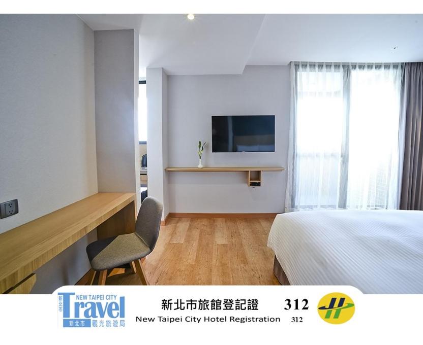 TV a/nebo společenská místnost v ubytování Yidear Hotel