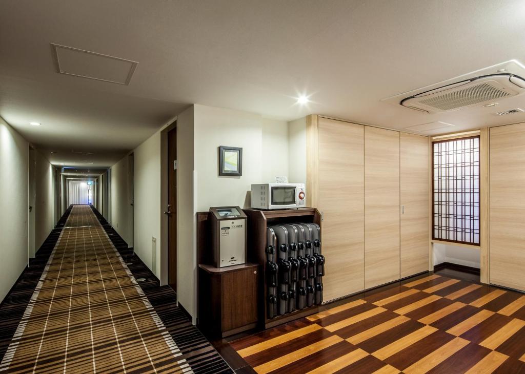 TV a/nebo společenská místnost v ubytování Fukui Manten Hotel Ekimae